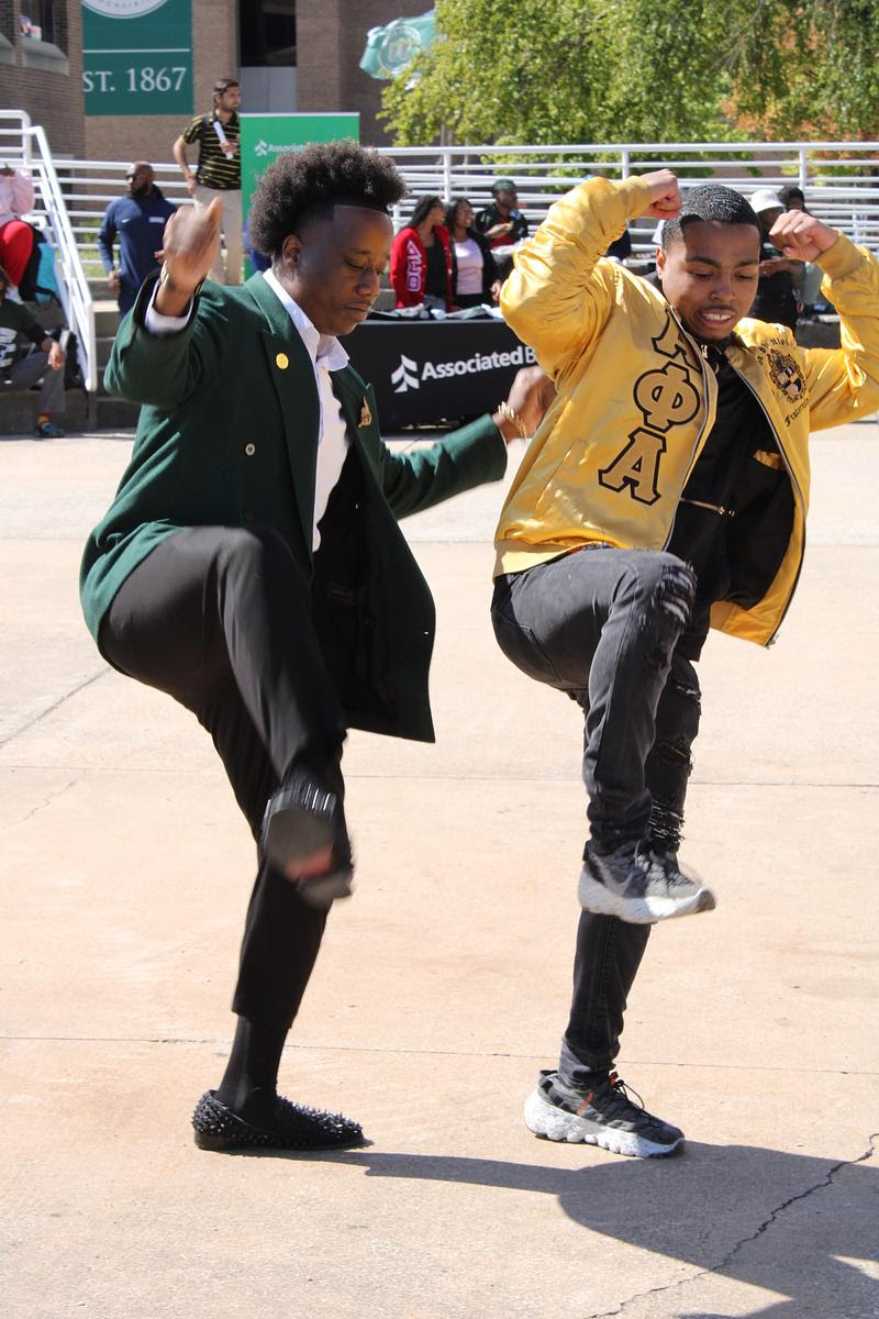 Two students dancing