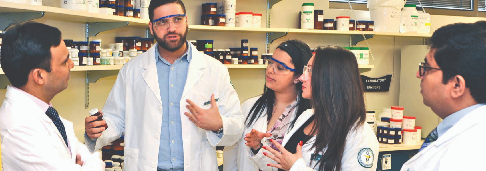 grad students having a discussion in a lab