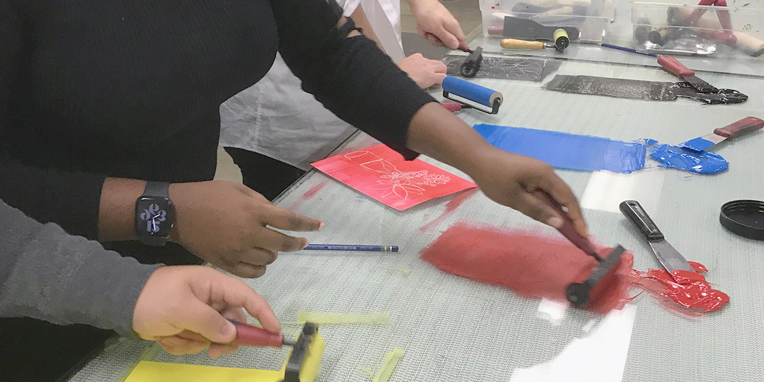 Students rolling ink for printing