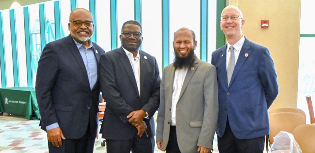 Deans LeRoy Jones II and Mark Smith stand alongside Dr. Christopher Botanga and Dr. Mohammad Salam at the STEM-Day Hackathon.