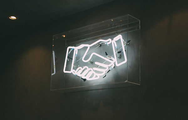 Hands Shaking Neon Sign Image